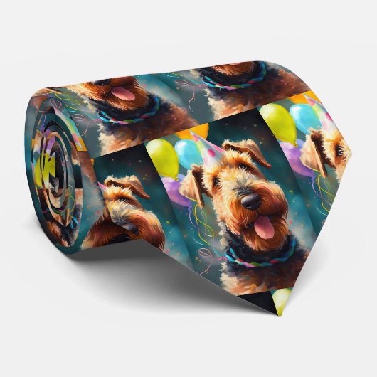 Airedale hond met verjaardagscadeau en pet stropdas (Opgerold)