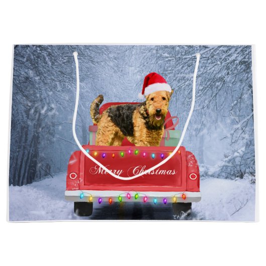 Airedale Terrier Dog in Snow, met Kerstmis Groot Cadeauzakje (Voorkant)