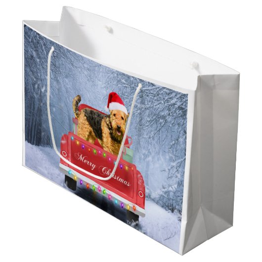 Airedale Terrier Dog in Snow, met Kerstmis Groot Cadeauzakje (Voorkant Gekanteld)