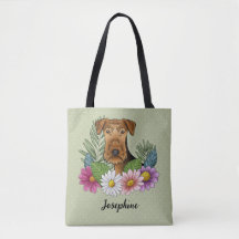 Airedale Terrier en kleurrijke zomerbloemen groen