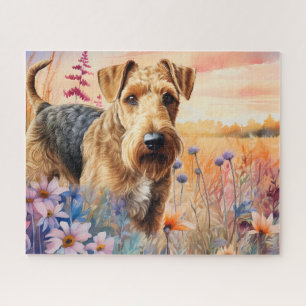 Airedale Terrier-hond in een weide met wilde bloem Legpuzzel