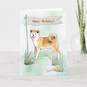 Akita Inu fokt hond onder verjaardagsbord Kaart