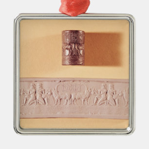 Akkadische cilinderverzegeling en indruk metalen ornament