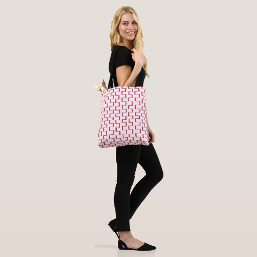 All-over-print rood geometrisch geschilderd patroo tote bag (Op model)