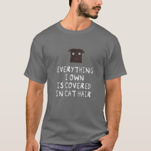 Alles wat ik bezit is gedekt in kat haar - grappig t-shirt