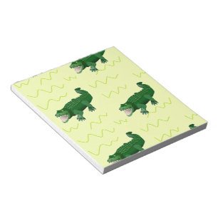 Alligator op geel notitieblok