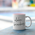 Aloha Beaches Tweekleurige Koffiemok<br><div class="desc">Op de mok van de zomer staan de "aloha stranden" in breezy,  handgeschreven brieven. We houden ervan op een tweetalige stijl met een roze binnenkant voor een pop van een kische zomerkleur!</div>