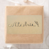 Aloha-woordbord op het strand etiket (Insitu)