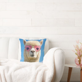 Alpaca die een roze hartvormige bril draagt kussen