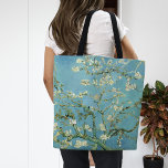 Amandelbloesems | Vincent van Gogh Tote Bag<br><div class="desc">Amandelbloesems (1890) van Vincent van Gogh (1853-1890). Van Goghs schilderij Amandelbloesems toont delicate witte bloemen tegen een levendige turquoise hemel, die nieuw leven en vernieuwing symboliseert. Geïnspireerd door de Japanse kunst, creëer de elegante takken en vloeiende lijnen een gevoel van sereniteit en natuurlijke schoonheid. De getextureerde penseelstreken en heldere, harmonieuze...</div>