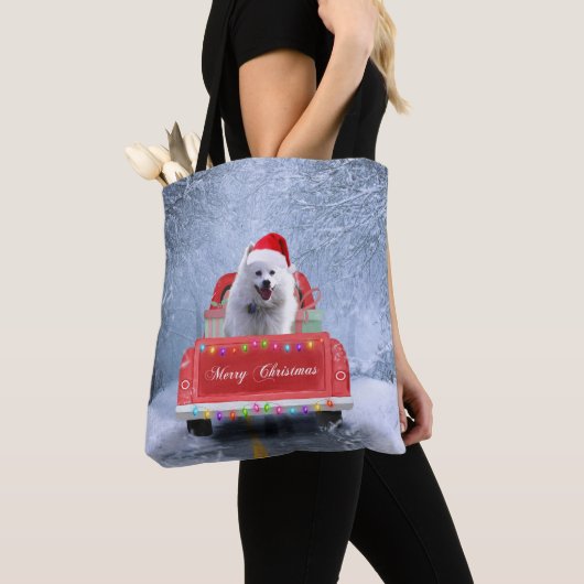 American Eskimo Dog in Snow, met Kerstmis als kers Tote Bag