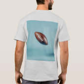 American football ball in the air with bright ligh t-shirt (Achterkant)