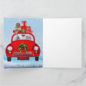 Amerikaanse eskimo-hond in auto's met kerstbedekki kaart (Binnen)