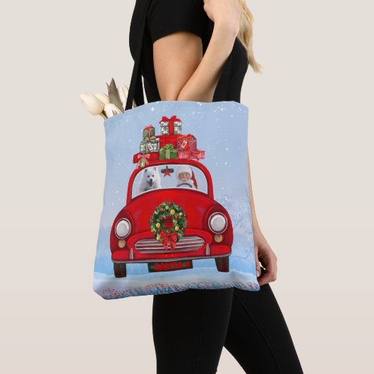 Amerikaanse eskimo-hond in auto's met kerstbedekki tote bag (Dichtbij)