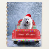 Amerikaanse Eskimo-hond in de sneeuw zittend op ke Planner (Voorkant)