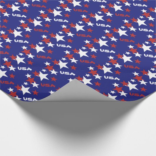 Amerikaanse rode en witte sterren op blauw cadeaupapier (Hoek)