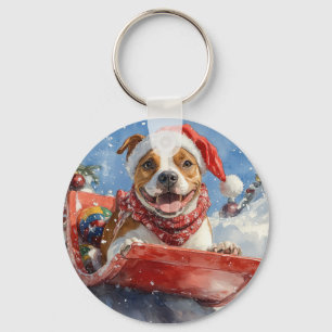 Amerikaanse Staffordshire in Kerst op een slee Sleutelhanger