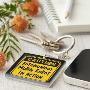 Amusante autonome mobiele robot in actie sleutelhanger