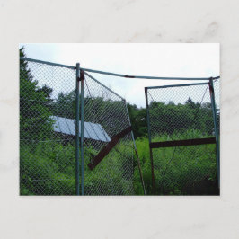An abandoned house beyond the broken fence. briefkaart
