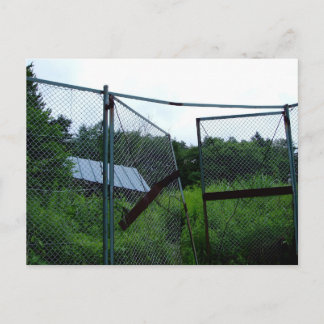 An abandoned house beyond the broken fence. briefkaart