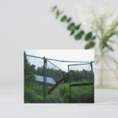 An abandoned house beyond the broken fence. briefkaart (Staand voorkant)