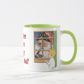Antiek kerstman die zijn vingerMok aan het wankele Mok