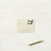 Antiek naaimachine met naam post-it® notes (Op bureau)