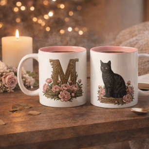 Antieke mok met zwart kat-monogram