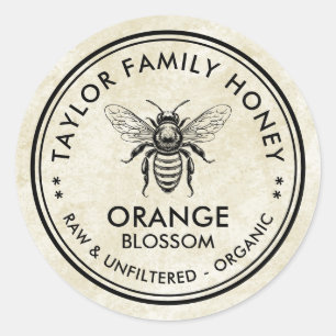 Antieke oranje Blossom honing label met honingbij