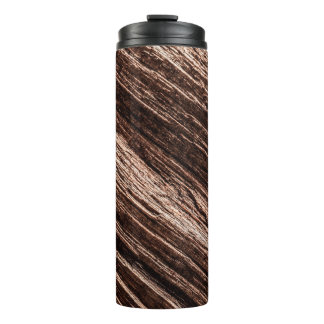 Antique brown obsolete wooden background. age-old, thermosbeker