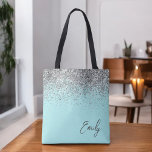 Aqua Blue Blauwgroen Silver Glitter Monogram Tote Bag<br><div class="desc">Aqua Blue Blauwgroen Silver Glitter Monogram Book Bag. Deze Book Bag kan worden aangepast om uw initiaal en voornaam op te nemen en wordt gegeven als cadeau voor Kerstmis,  Sweet 16 Birthday,  Vrijgezellenfeest of een bruiloft.</div>