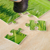 Argentijnse empanada-voetbalspeler springt om de b legpuzzel (Zijkant)