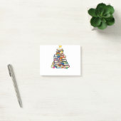 Arme kerstboomleraren houden van boeken lezen post-it® notes (Kantoor)