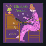 Art Deco Lady Auteur in Schrijfbureau in Roze Vierkante Klok<br><div class="desc">Deze gepersonaliseerde vierkante wandklok heeft een Art Deco stencil. Een vrouw in een roze jurk zit aan een schrijfbureau met een pen opgetild terwijl een lamp naast haar schijnt. De achtergrond is donker paars. De vrouw ziet eruit alsof ze uit de 19e of vroege 20e eeuw komt. Het ontwerp heeft...</div>