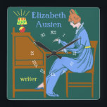 Art Deco Lady Auteur op schrijfbureau in blauw Vierkante Klok<br><div class="desc">Deze gepersonaliseerde vierkante wandklok heeft een Art Deco stencil. Een vrouw in een blauwe jurk zit aan een schrijfbureau met een pen opgetild terwijl een lamp naast haar schijnt. De achtergrond is donker blauwgroen. De vrouw ziet eruit alsof ze uit de 19e of vroege 20e eeuw komt. Het ontwerp heeft...</div>