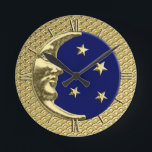 Art Deco Moon en Stars, Navy Blue en Gold Ronde Klok<br><div class="desc">Klok in een klassiek Art Deco moon en sterren ontwerp in geborsteld zilver met een enamel blauw/indigoachtergrond</div>
