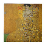 Art Lady gouden kleurrijke jurk | Gustav Klimt Tegeltje<br><div class="desc">Deze keramische tegel is geïnspireerd op het iconische kunstwerk van Gustav Klimt en heeft een ontwerp met een dame in een goudkleurige jurk, die elegantie en allure uitstraalt. Deze Art Lady Gold kleurrijke, op mode geïnspireerde keramische tegel is een hot item dat kunst naadloos combineert met hedendaags design en is...</div>