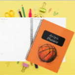 Artistiek Basketbal Sport Kinder Planner<br><div class="desc">Introductie van de "Artistic Basketball Sports Kinderen Planner", de perfecte organisatietool voor jonge basketballiefhebbers en aspirant-atleten! Deze boeiende planner heeft een handgetekende basketbal tegen een levendige oranje achtergrond. De dynamische en gedetailleerde illustratie creëer is een energieke en inspirerende cover die de passie van je kind voor het spel zal aanwakkeren....</div>