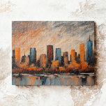 Autumn City Skyline Sunset Legpuzzel<br><div class="desc">This jigsaw puzzle features an abstract acrylic painting that beautifully captures a cityscape at sunset. It's composed of bold, geometrically shaped buildings standing against the backdrop of a dramatic sky. The buildings, in shades of blue, gray, and black, add a sense of depth and dimension to the scene. The waterfront,...</div>