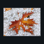 Autumn Maple Leaf in Real Hail - Dramatic Weather  Briefkaart<br><div class="desc">A unique macro shot of a bright orange maple leaf lying on a thick layer of fresh hail stones. This rare weather event captures the raw beauty of a sudden hailstorm during the autumn season. The contrast between the warm leaf and the icy white hail creates a stunning visual.</div>