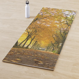 Autumn path with yellow trees and fallen leaves yogamat