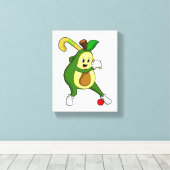 Avocado bij Hockey met Hockey bat Canvas Afdruk (Insitu (Houten vloer))