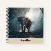 Aziatische olifant in een Sunlit Forest Clearing Notitieboek (Voorkant)