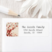 Aziatische stijlschilderende pruimelbloesem in het etiket (Insitu)