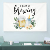 Baby brouwt bier en voert fles spandoek (Beurs)