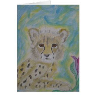 baby cheetah en bloem