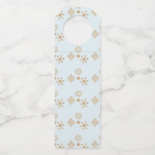 Baby het is koud buiten goudneeuwvlokken op blauw flessenhanger (Achterkant)