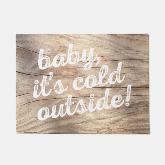 baby, het is koud buiten. over de achtergrond van deurmat (Voorkant)