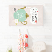 Baby is een teelroze en groene theepartij spandoek (Insitu)