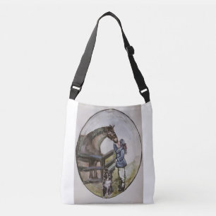 baby paardenmerg in stallen, aan de ene kant en aa crossbody tas